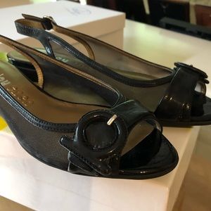 Black patent leather flats. Joy Chen.